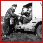 [Photo] 485th personnel brave the deep mud to deliver the Group's mail.