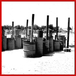 [Photo] A fleet of tent-stoves - waiting for winter at the 461st Bomb Group camp.